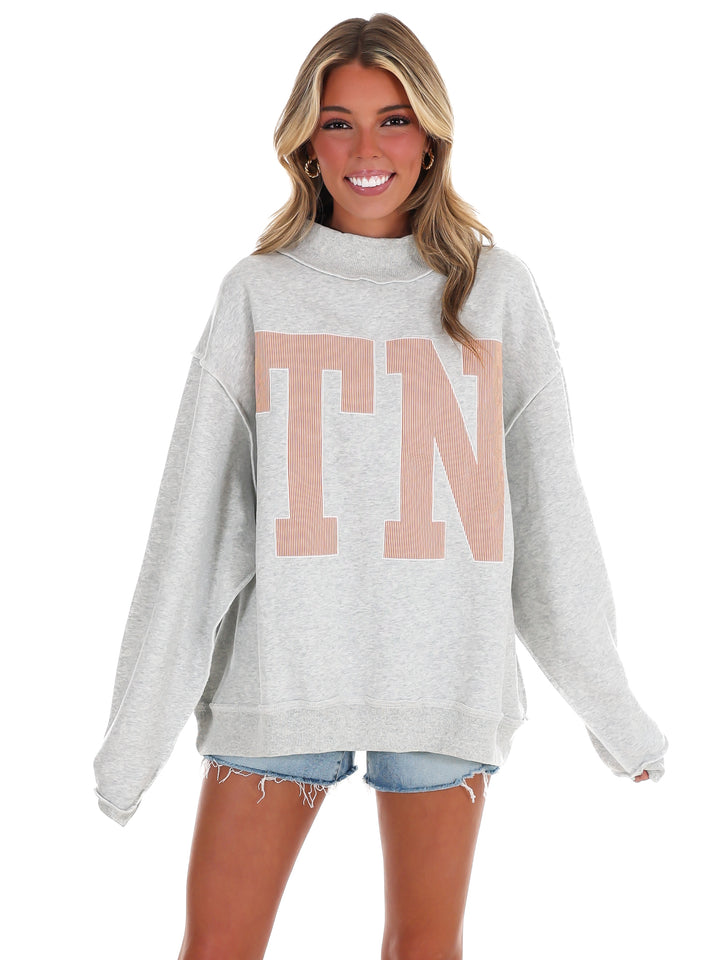 Stripe Embroidered TN Mock Neck Sweatshirt