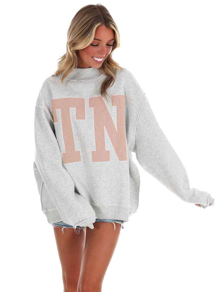 Stripe Embroidered TN Mock Neck Sweatshirt