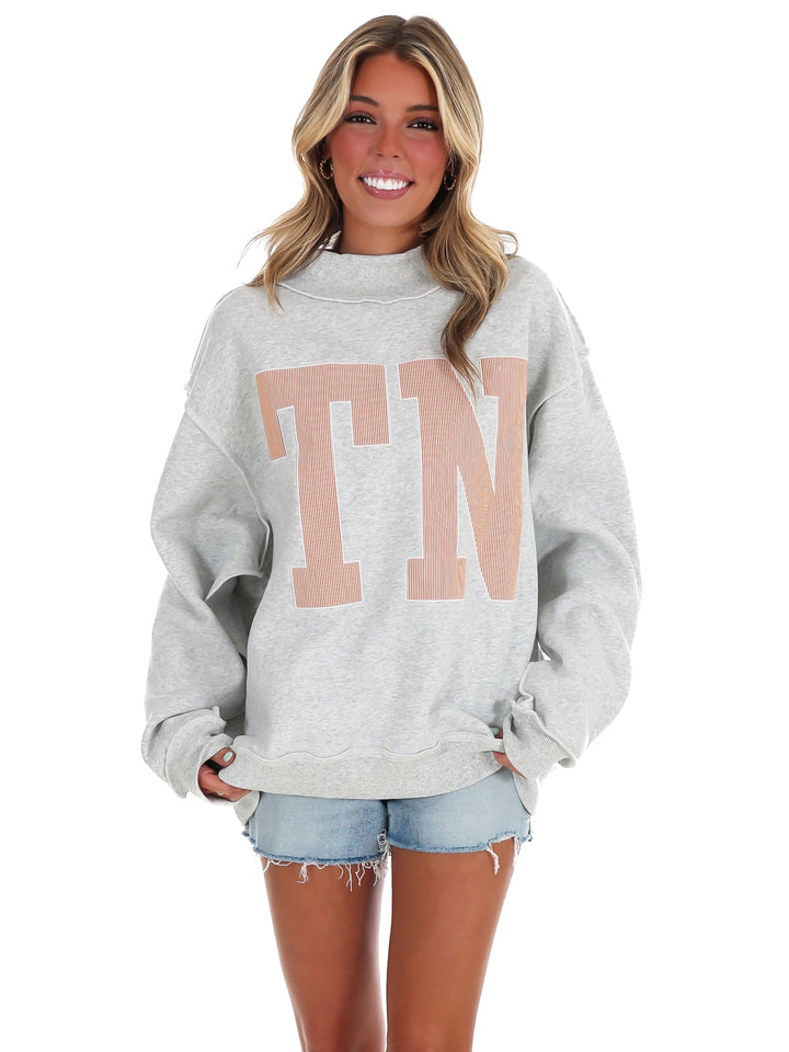 Stripe Embroidered TN Mock Neck Sweatshirt